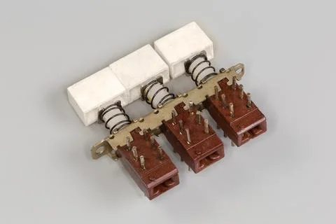 Old electrical modular push button switch on a gray background Stock Photos