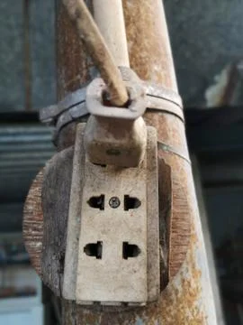 Old electrical outlet On a rusty pole Stock Photos
