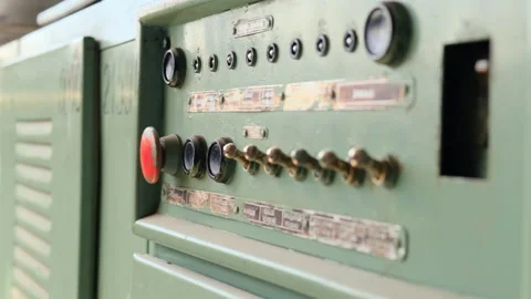 Old electrical panel in abandoned factory with red button and shiny position Stock Footage 155330942