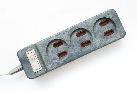 An old electrical power extension cable with european sockets on white Stock Photos