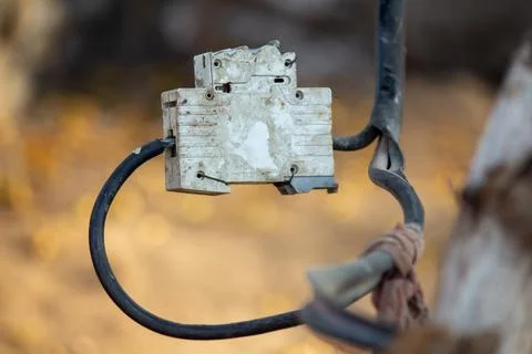 Old electrical switch box with exposed wires rural power connection close-up Stock Photos