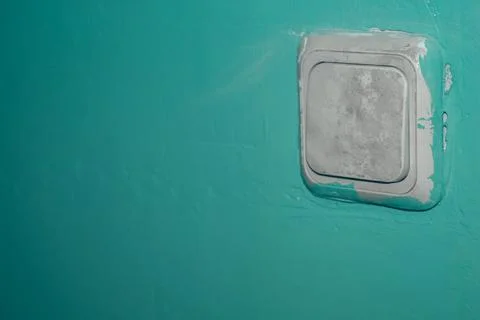 Old electrical switch on the wall. Stained with paint overhead light switch Stock Photos