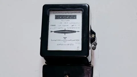 An old electricity meter, electric, electrical energy kilowatt-hour meter Stock Footage 287003286