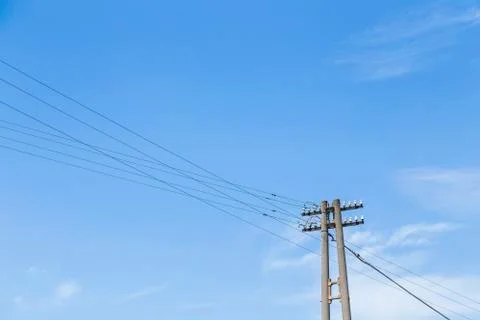Old electricity post with blue sky Stock Photos