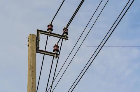 Old electricity post on dark clouds Stock Photos