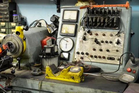 Old electro-mechanic tool in a workshop Stock Photos