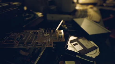Old electronic components and disassembled devices on a cluttered workbench Stock Footage 304467698