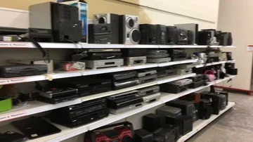 Old electronics for sale at a thrift store Stock Footage 85822379