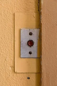 Old elevator call button with grungy pattern in a soviet building in post-soviet 写真素材