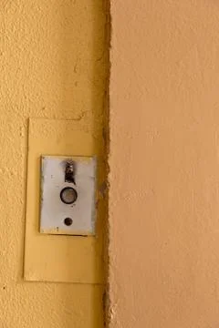 Old elevator call button with grungy pattern in a soviet building in post-soviet 写真素材