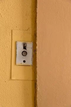 Old elevator call button with grungy pattern in a soviet building in post-soviet 写真素材