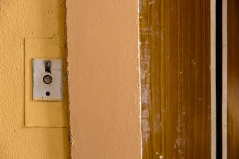 Old elevator call button with grungy pattern in a soviet building in post-soviet 写真素材