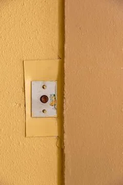 Old elevator call button with grungy pattern in a soviet building in post-soviet Stock Photos