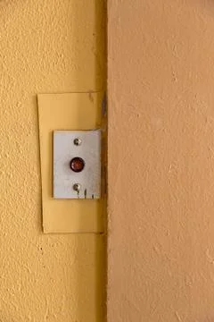 Old elevator call button with grungy pattern in a soviet building in post-soviet 写真素材