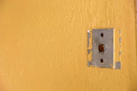 Old elevator call button with grungy pattern in a soviet building in post-soviet 写真素材