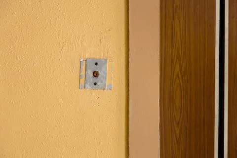 Old elevator call button with grungy pattern in a soviet building in post-soviet 写真素材