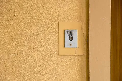 Old elevator call button with grungy pattern in a soviet building in post-soviet 写真素材