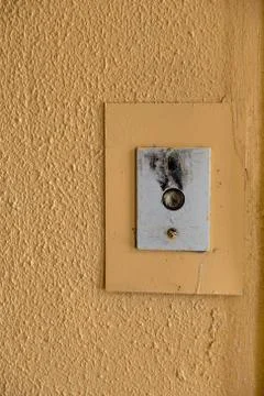 Old elevator call button with grungy pattern in a soviet building in post-soviet 写真素材