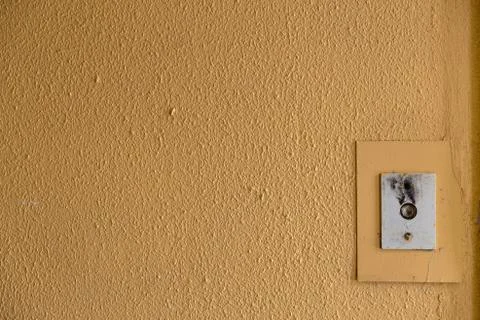 Old elevator call button with grungy pattern in a soviet building in post-soviet 写真素材