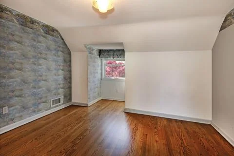 Old empty attic bedroom with beautiful floor. Stock Photos
