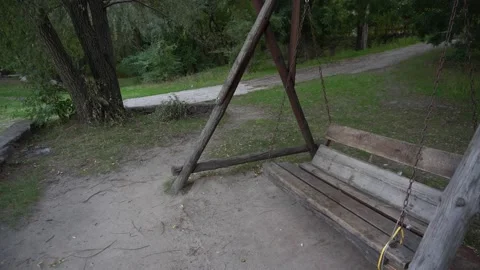 Old empty bench swing bench in the park Stock Footage 143465488