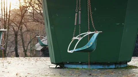 Old Empty Carousel Swings in Abandoned Park at Sunset 動画素材 329803361