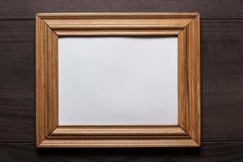 Old empty frame on wooden wall Stock Photos