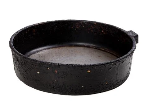 Old empty frying pan isolated on white background Stock Photos
