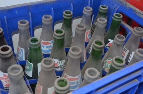 Old empty glass bottles of exticted brands of sodas. Brasil Stock Photos