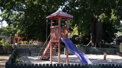Old empty playground with slide and sand. handheld static Stock Footage 106885556