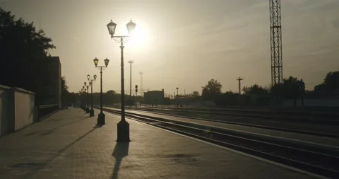 Old empty railway station against the background of the setting sun Stock Footage 140191747