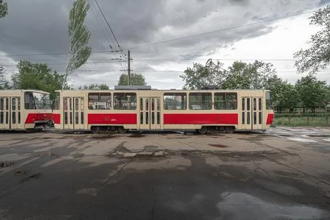 Old empty red Tatra T5 tram in cloudy day. View from the side. Stock-Fotos