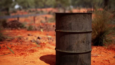 Old empty rusted barrel on sand Stock Footage 238454033