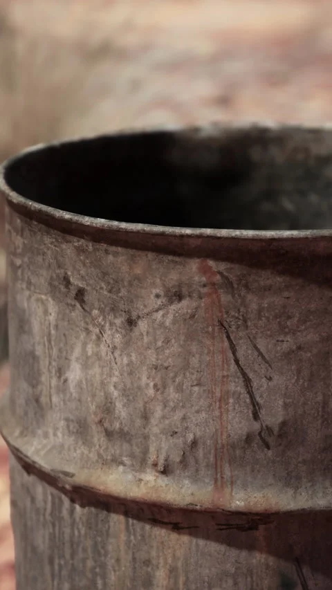 Old empty rusted barrel on sand Stock-Footage 293247842
