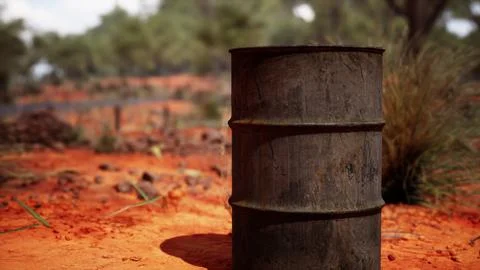 Old empty rusted barrel on sand Illustrazione stock