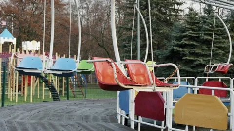 Old Empty Swing Ride in an Abandoned Amusement Park Stock Footage 326036580