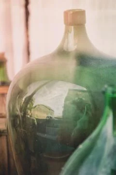 Old empty wine bottles behind the glass Stock Photos