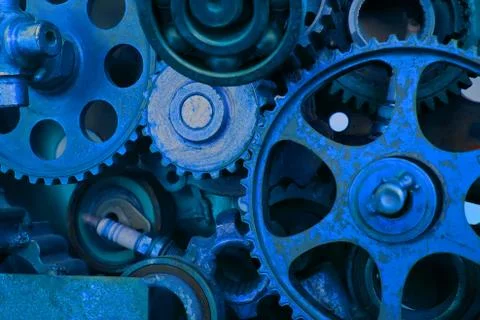 Old engine gear wheels, closeup view. Retro style. Trend color classic blue p Stock Photos
