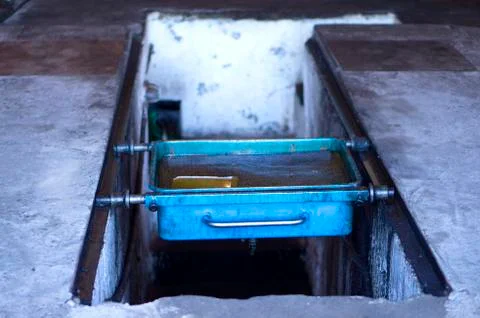Old engine, machine oil. Used oil. Bath of used engine oil. Stock Photos