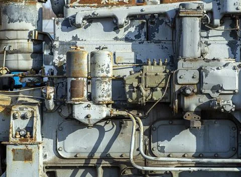 Old engine - motor, machine tool, mechanism background. Old metal fragment of Stock Photos