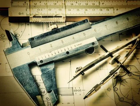Old engineering tools on a technical drawing Foto stock