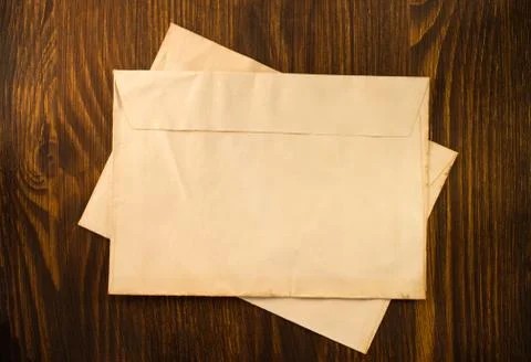 Old envelope on wood Stock Photos