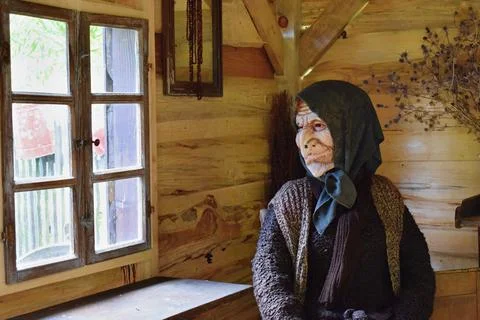 Old epiphany witch dolly sitting in her house Fotos Stock