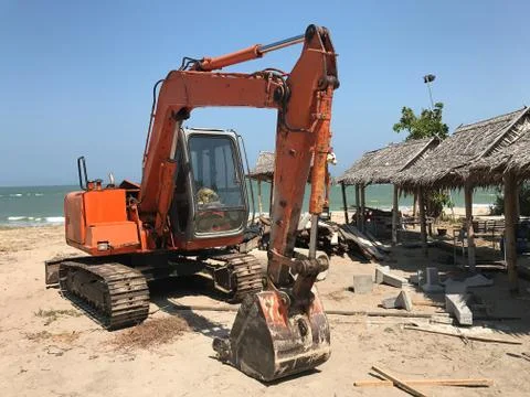 Old excavator on the beach Stock Photos