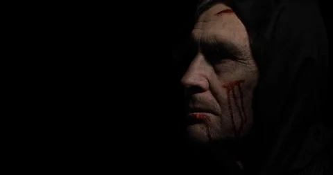 Old executioner Halloween makeup and costume. Elderly man with blood on his face Stock Footage 115373666