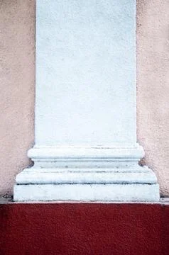 Old facade column with a claret background underneath Stock Photos