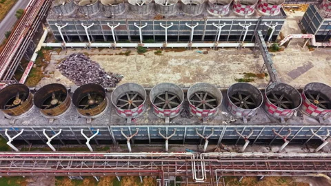 Old factory building with large cooling towers and broken structures during Stock Footage 340963700