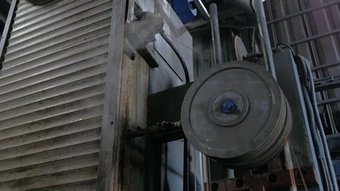 The old factory has outdated equipment, a Rotating wheel and steam. Stock Footage 125263342