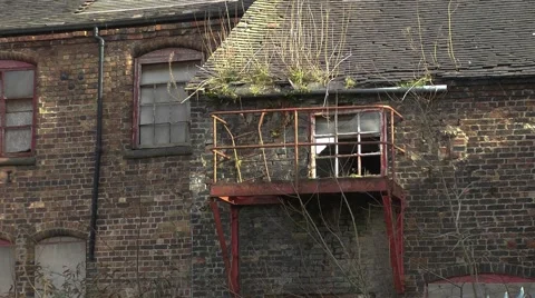Old factory red fire escape brick broken windows decay.mp4 Stock Footage 47412268