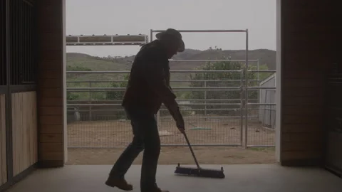 Old Farmer Man Sweeping Barn Floor Stock Footage 270334936